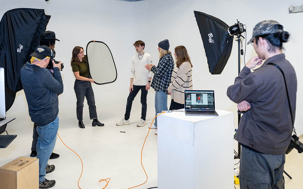 students and faculty in photography studio lighting class