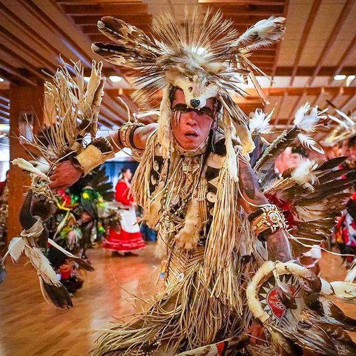 A Pow Wow dancer performing at an event