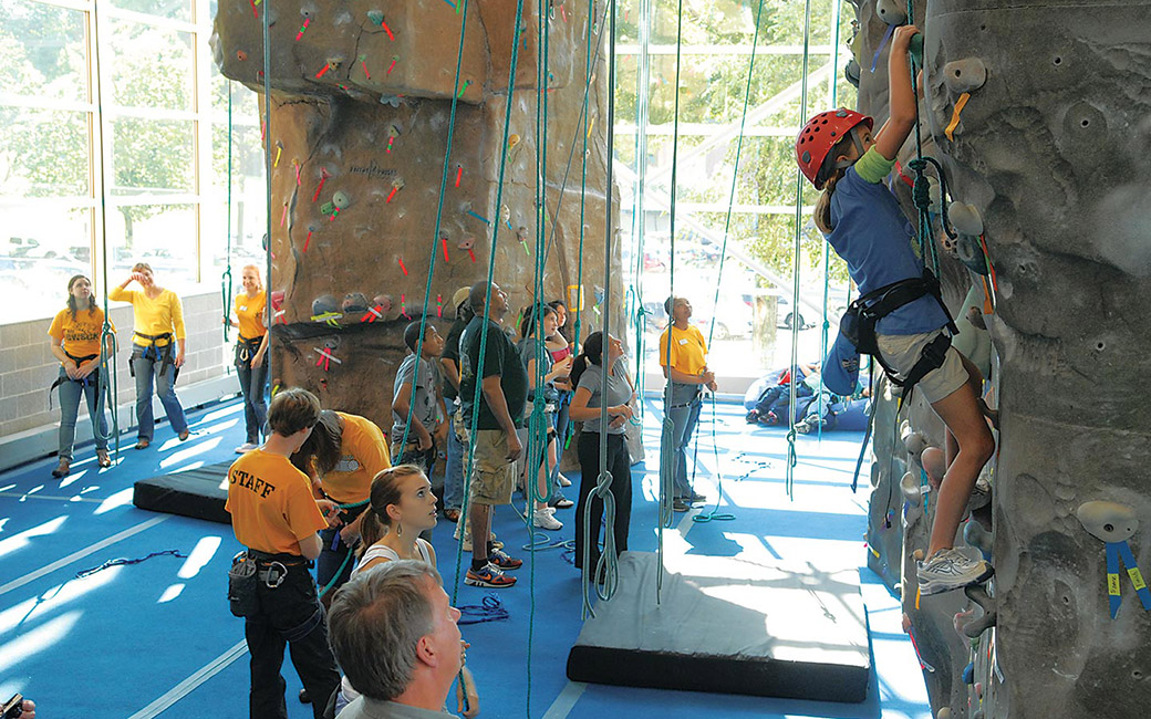 Students climbing the Rock Wall at Burdick Hall
