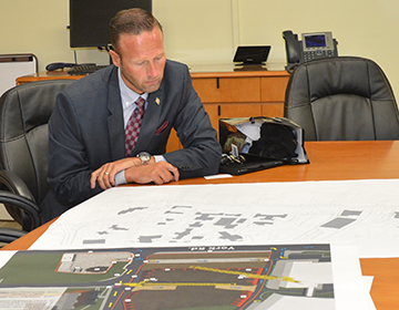 Greg Slater looking at construction maps
