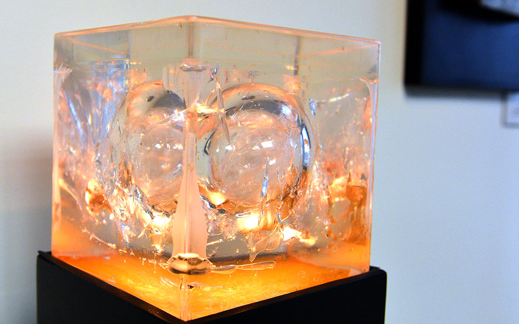 A lucite cube sculpture by Feliciano Bejar (1920-2007)