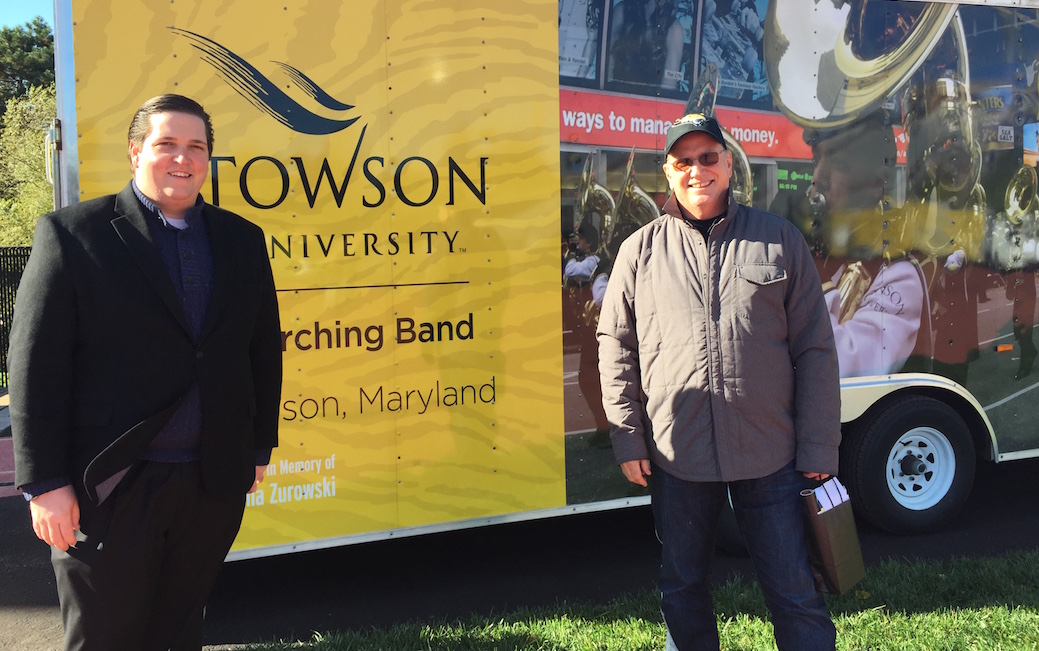 Neil and Nick Zurowski stand in front of the marching band truck wrap made possible by their gift to TU.