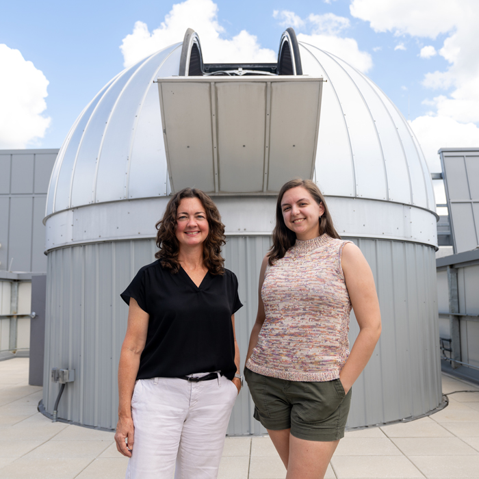 Jennifer Scott and Shannon Markward pose outside the Towson University Observatory