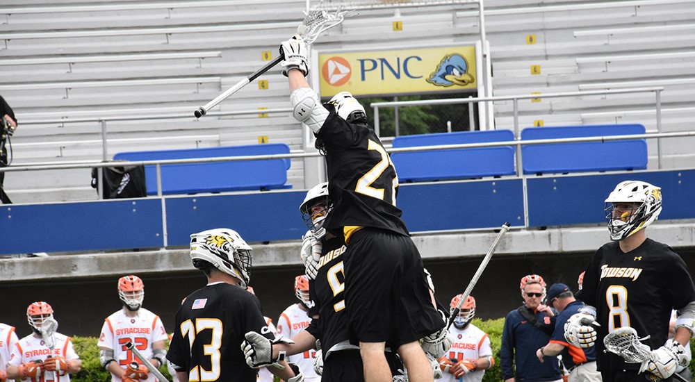 The Towson University men's lacrosse team celebrates after scoring a goal in Sunday's NCAA Tournament Quarterfinal game against Syracuse. The Tigers defeated the Orange, 10-7, and will move on to the NCAA Tournament Semifinals. 