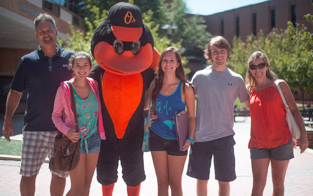 The Oriole mascot with a family