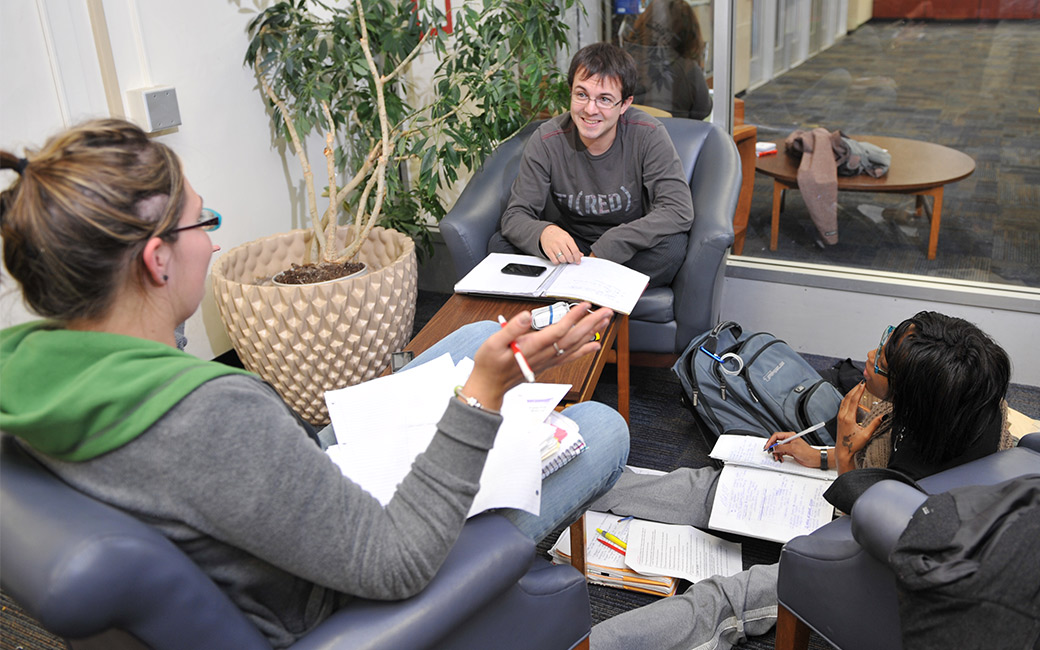 Three students in Cook Library