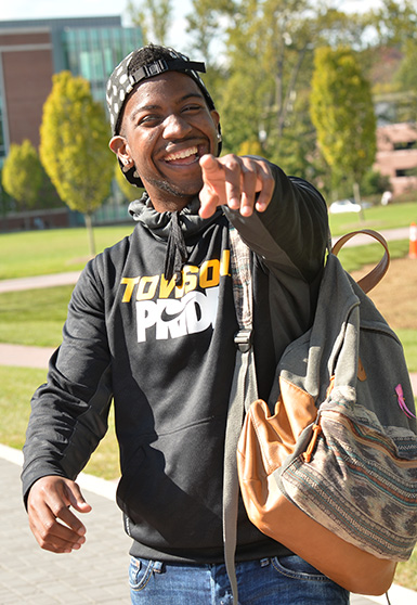 student pointing at the camera