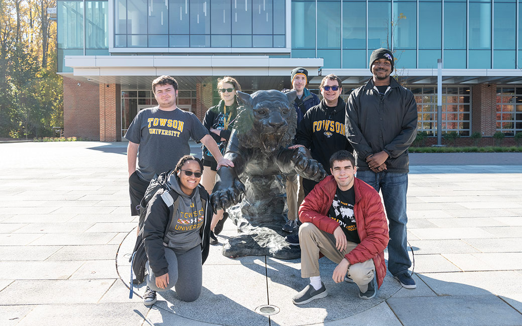 students grouped around tiger statue in front of University Union