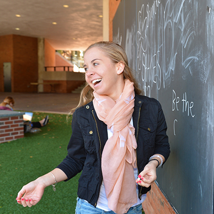 female student at chalkboard in Freedom Square