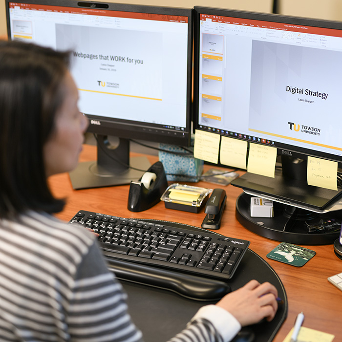 TU staff member working on a PowerPoint presentation