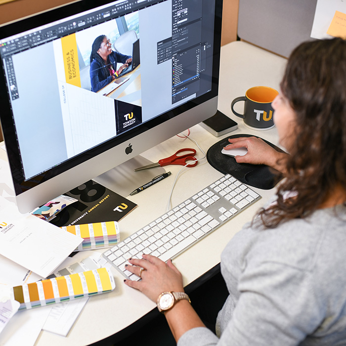 TU employee working on a computer