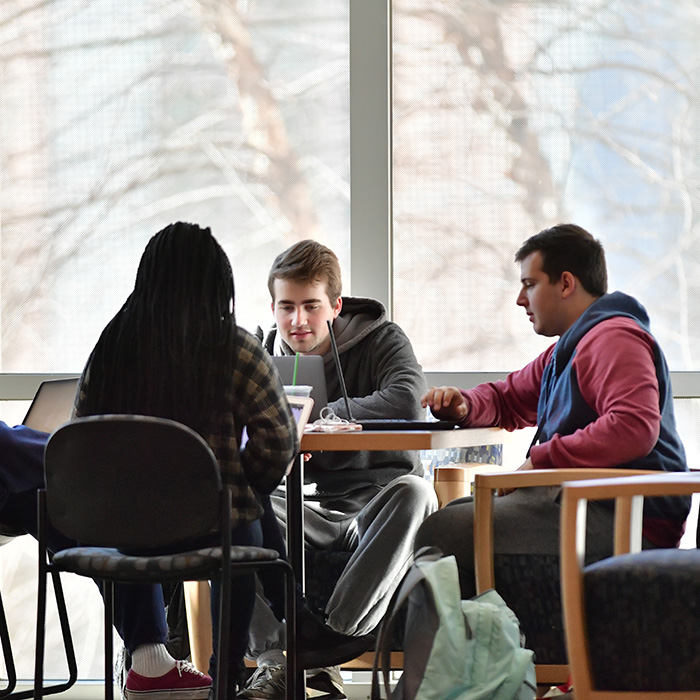 TU students sitting at a table