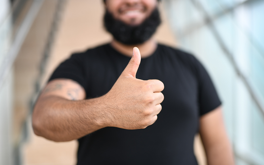 TU employee giving the thumbs up sign