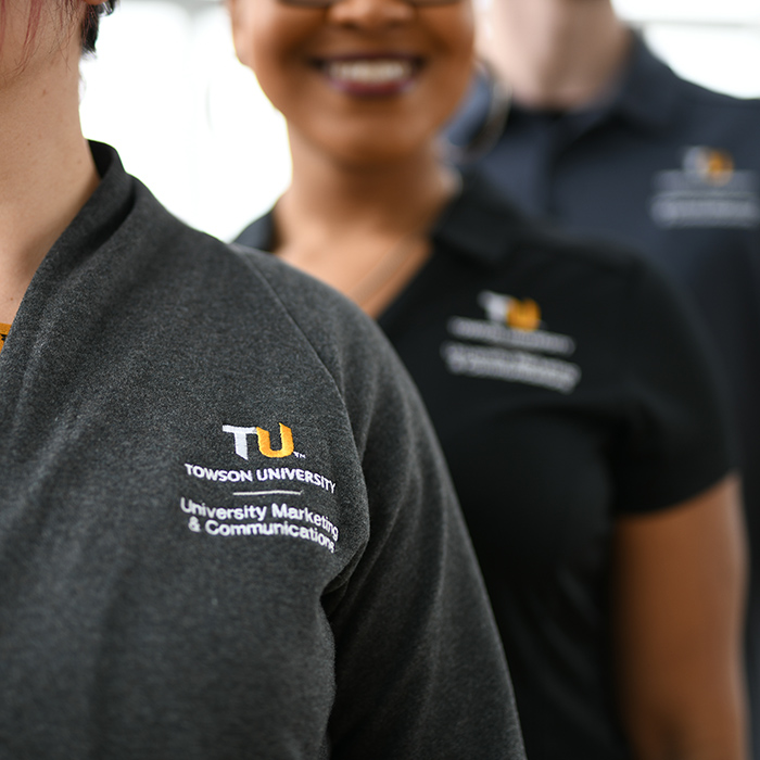 TU employees wearing TU branded clothing