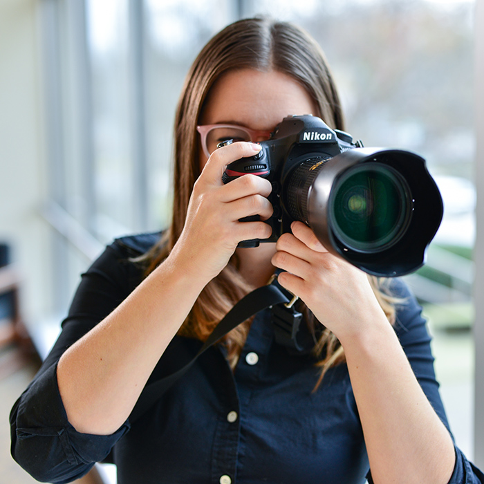 TU photographer holding camera