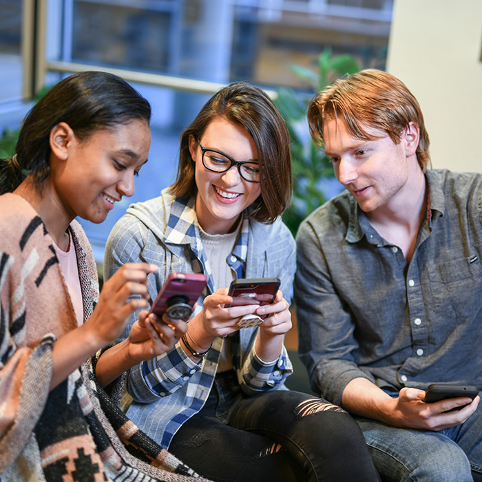 Students looking at their phones