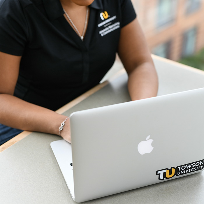 TU employee working on a laptop