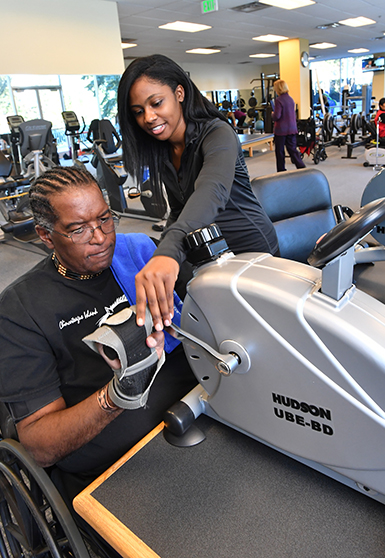 student working with community member at institute for well-being