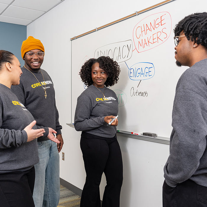 TU students debating an issue in a classroom