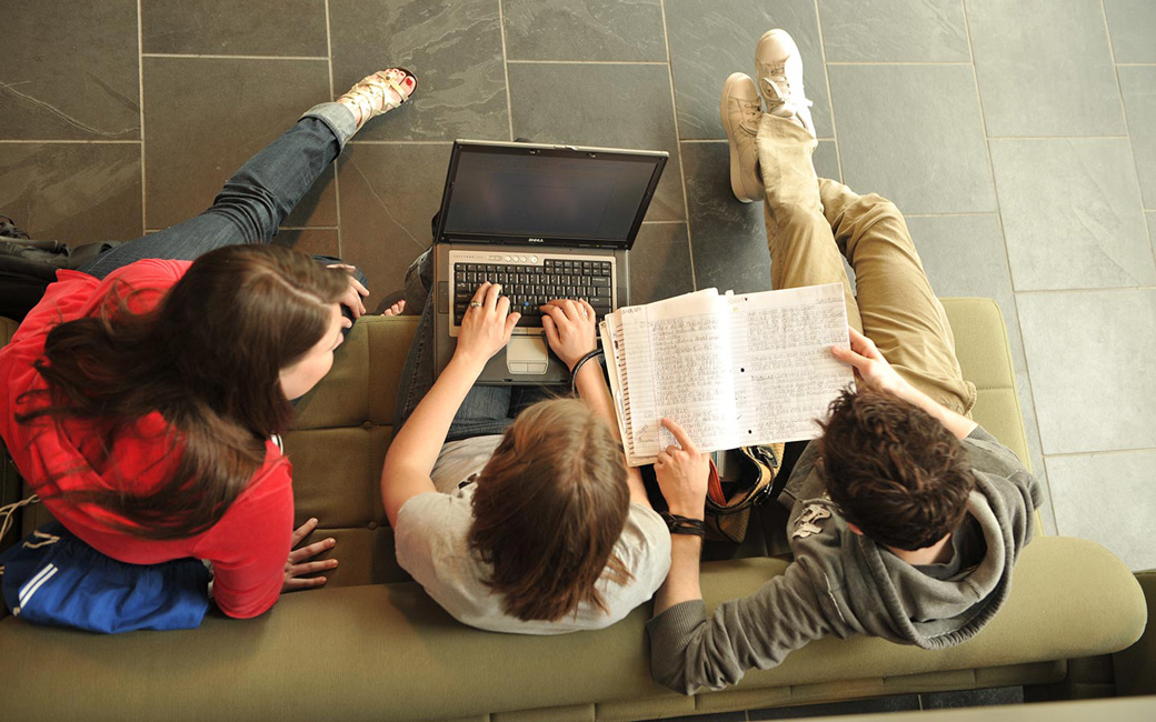 students at Career Center looking at computer