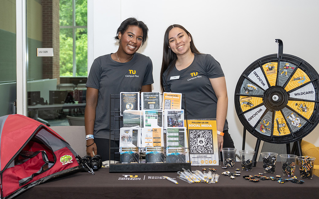 Student interns working at Campus Rec tabling