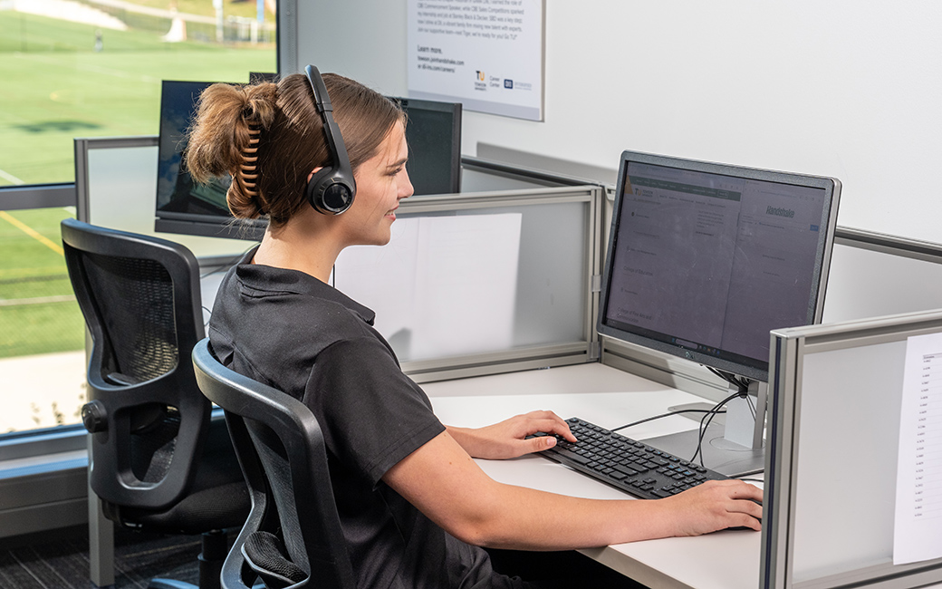 Student employee working at computer