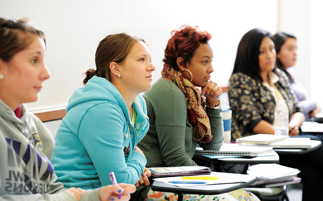 Multiple students sitting in classroom