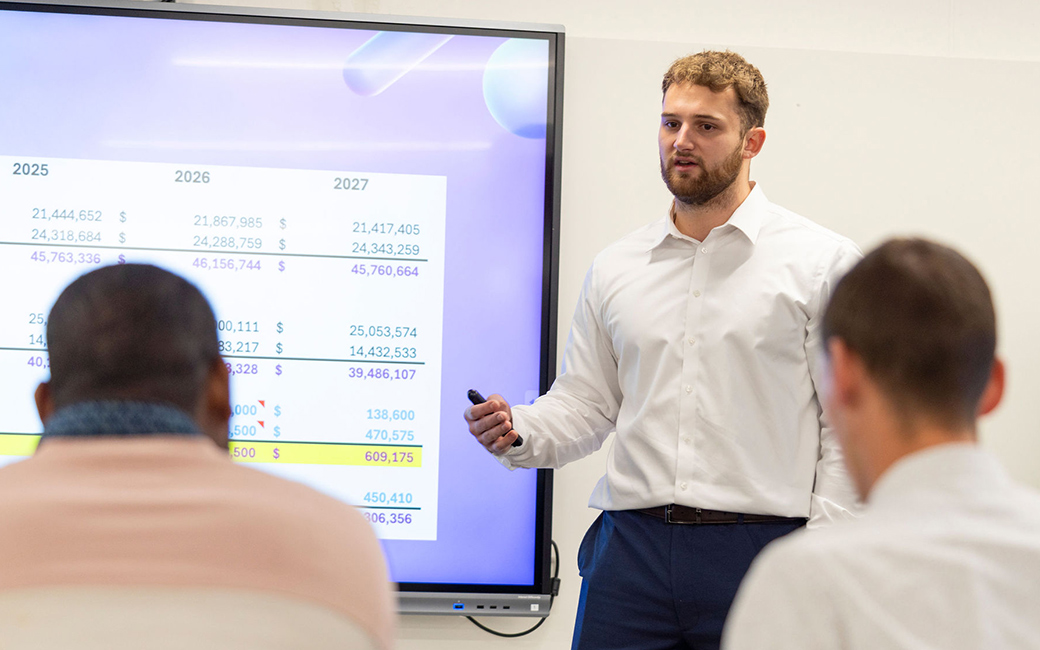 Student presents to panel in business class