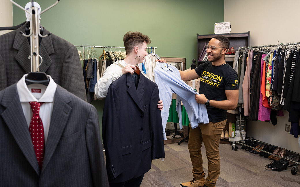 Two students pick out suit jackets