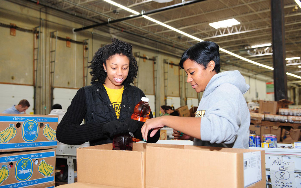 Students sorting food at the food bank