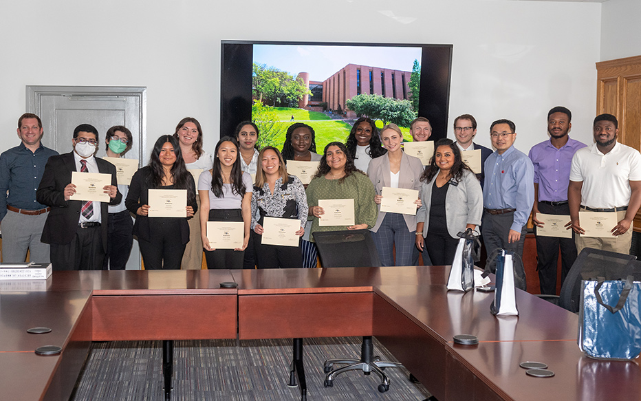 Data Analytics Competition participants pose with their winning certificates