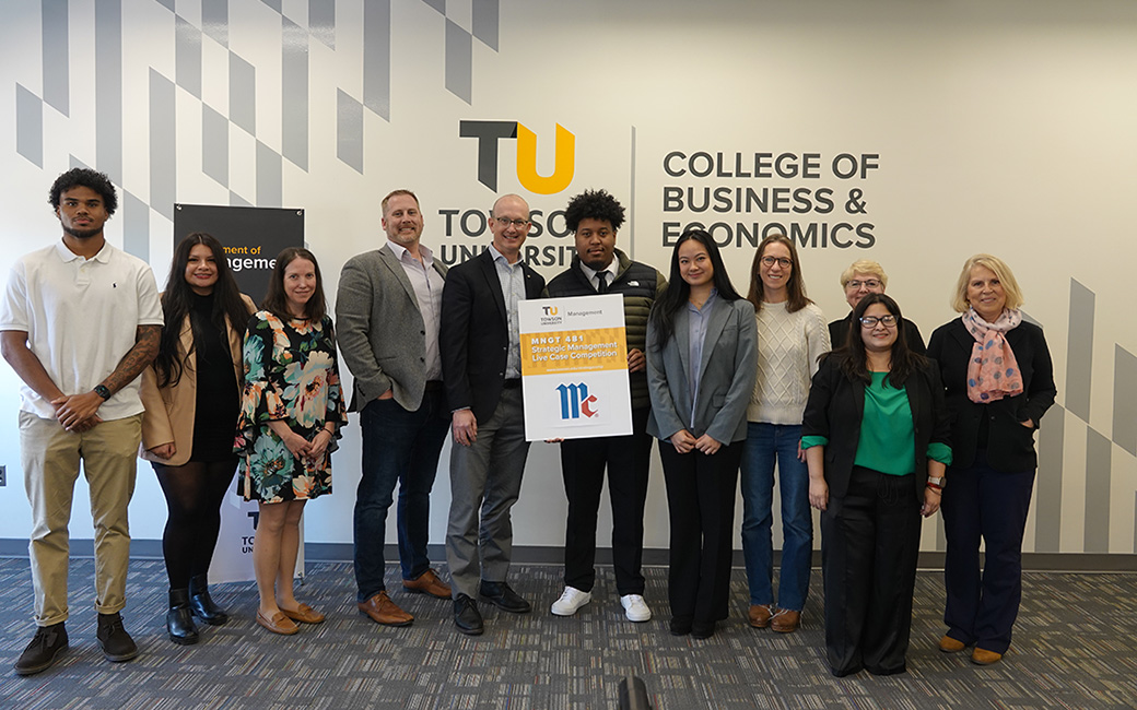 Students pose with faculty and business representatives