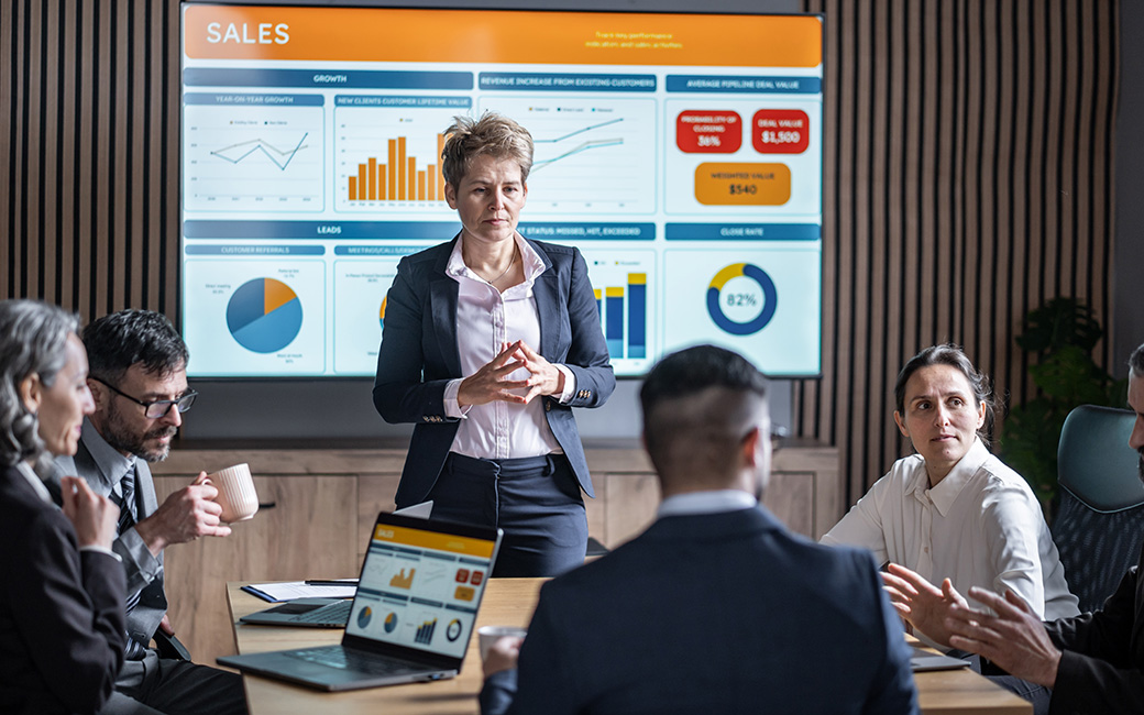 Individual people talking at a sales presentation