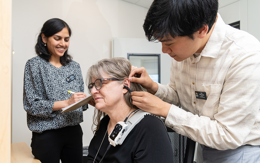 Student and faculty test client's hearing