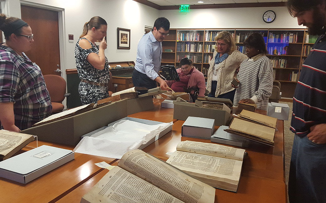 Jewish Studies Students at the Library looking at Archives