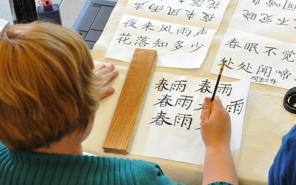 Student learning to write Chinese characters