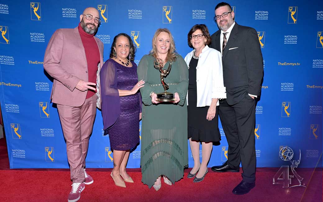 Krista Respass and her team with an Emmy