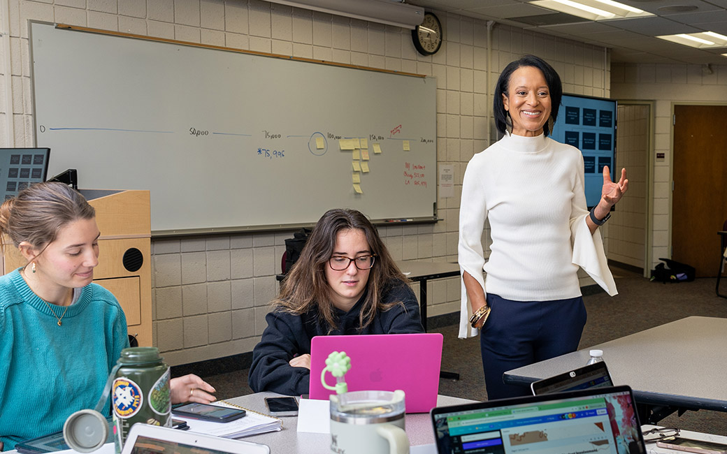 Tamera Moore (right, standing) and two students