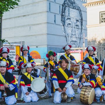 Members of the HanPan Korean traditional percussion youth group pose after performing at the 2024 Asia North Opening Event