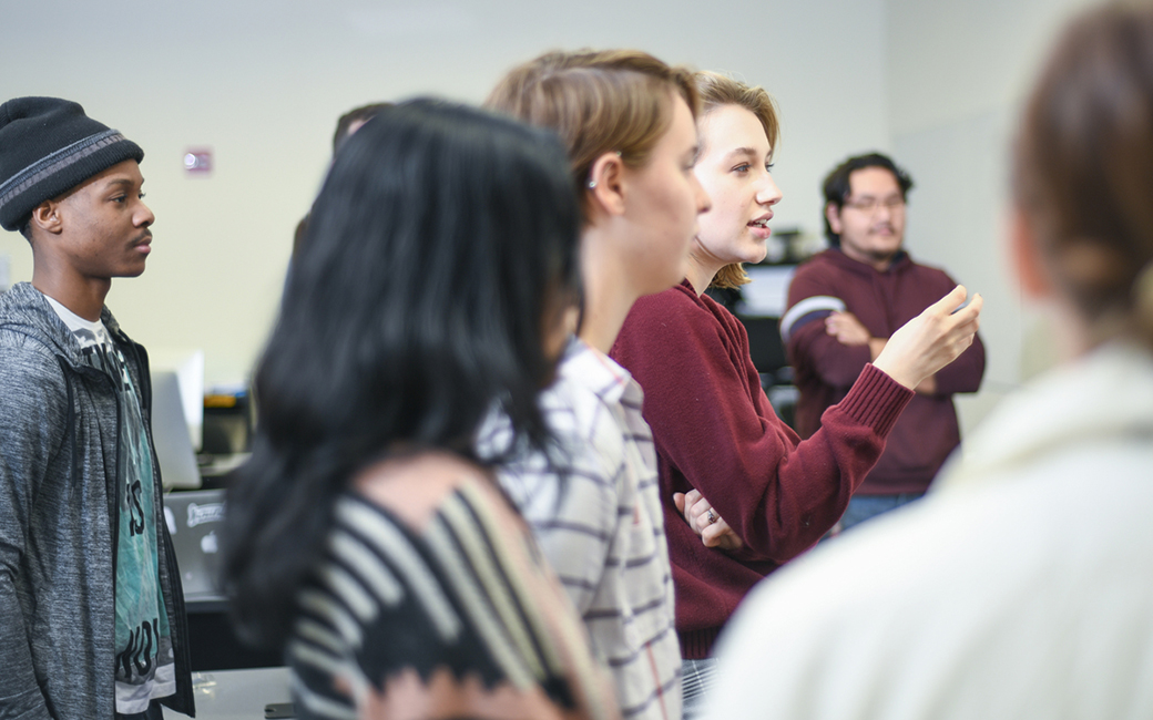 students participate in a critique