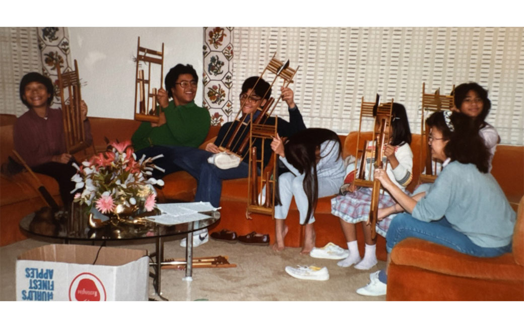 Practicing the angklung for a performance