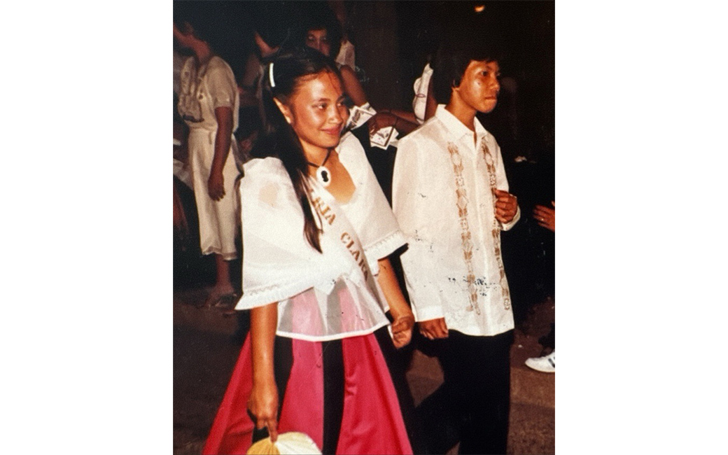 Magno wearing traditional Maria Clara dress in the Santacruzan procession