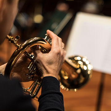 Close up on trumpet player