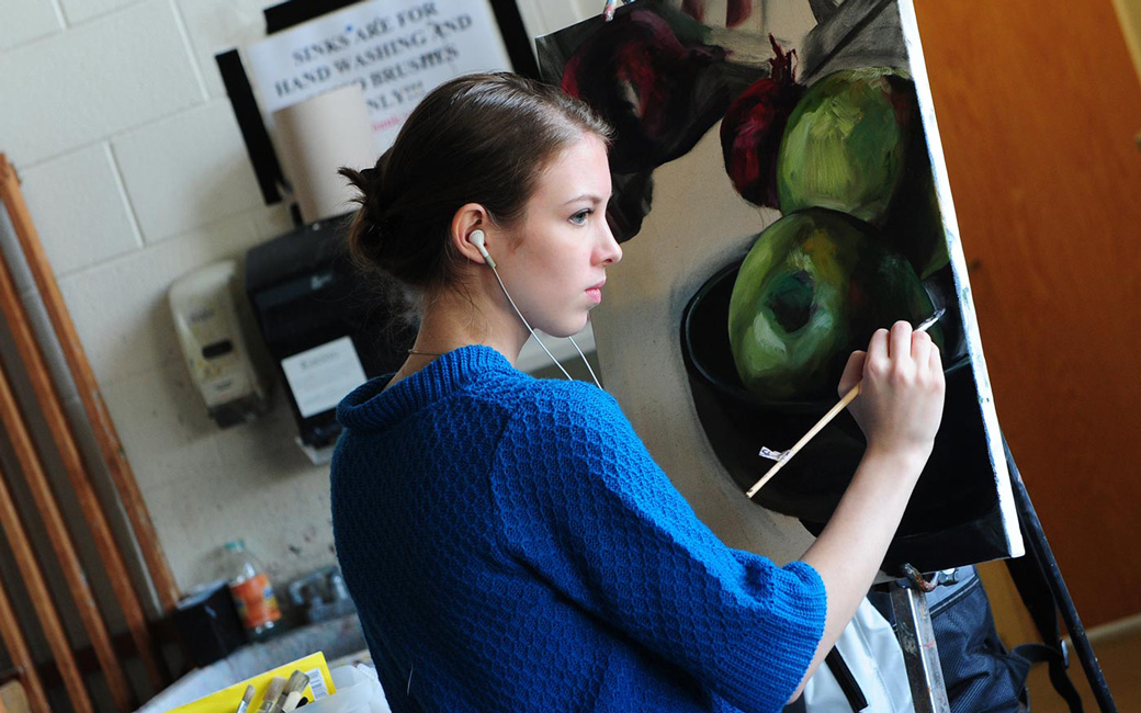 student painting in studio