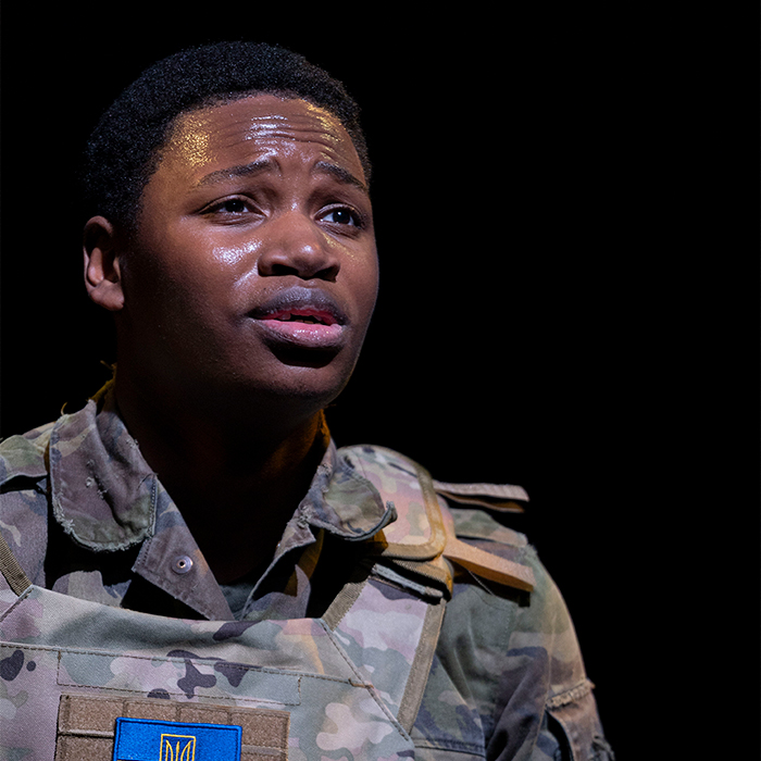 student performing on stage