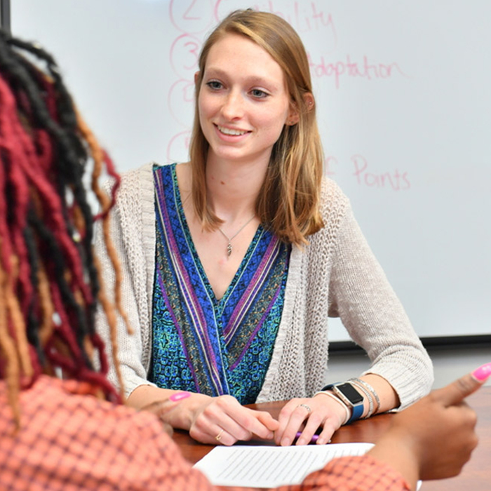 Caucasion woman interacting with African-American woman