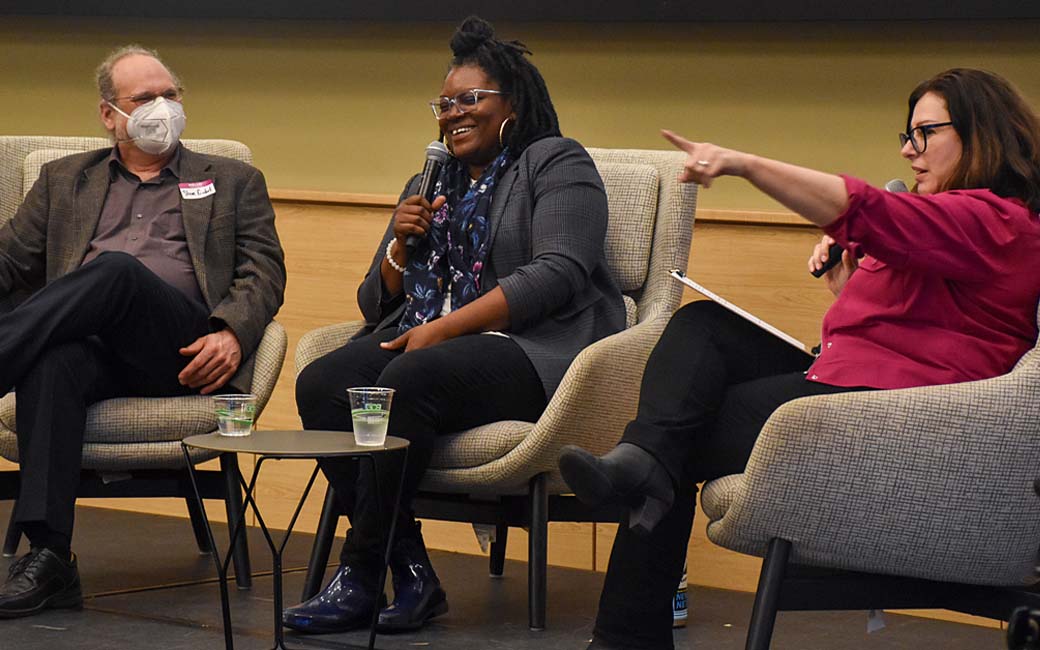 Osher at Towson University Executive Director Tracy Jacobs (right) points to the audience while panelists Steven Gimbel, Ph.D. (left), and Michelle Faulkner-Forson (center) share a laugh at TU University Union on Thursday, April 11