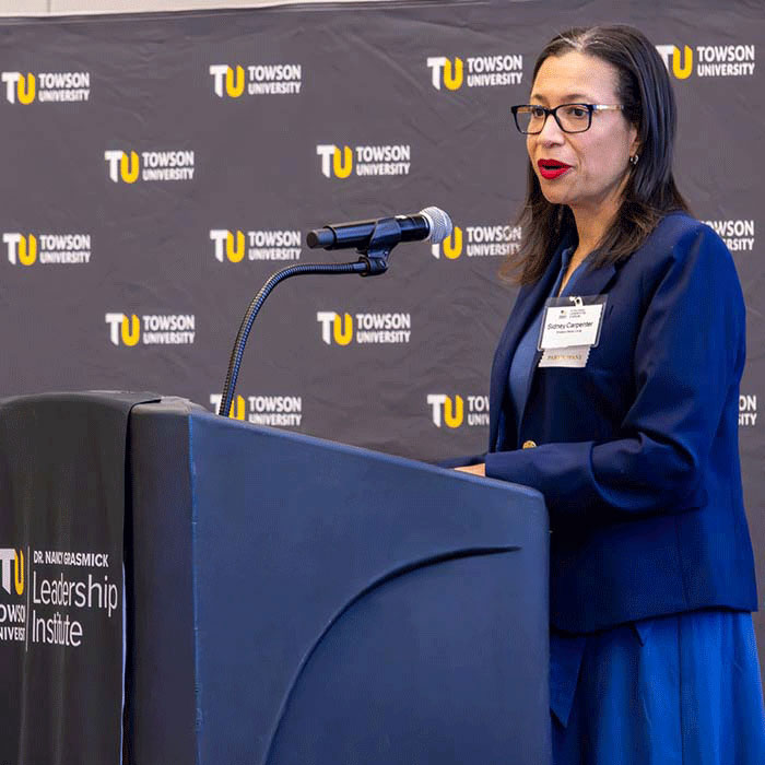 woman speaking at podium