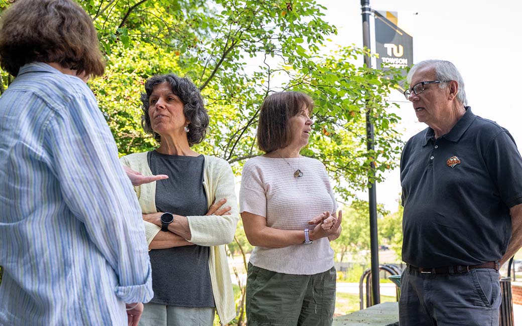 osher students gathered under trees