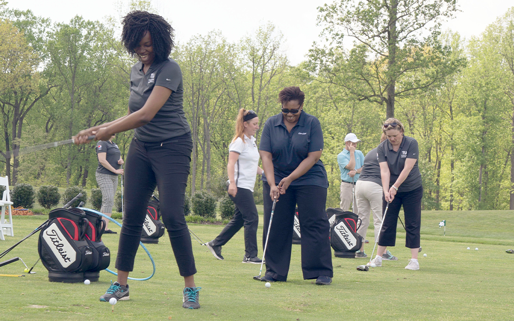 Diverse group of women attending the golf session